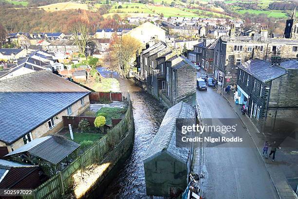 The River Calder back to its normal level after bursting its bank's yesterday in the Calder Valley town of Mytholmroyd on December 27, 2015 in...