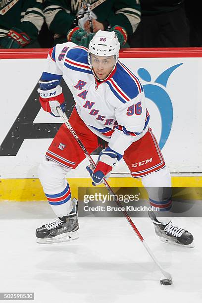 Emerson Etem of the New York Rangers handles the puck against the Minnesota Wild during the game on December 17, 2015 at the Xcel Energy Center in...