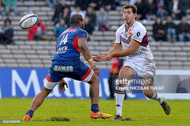 Bordeaux-Begles' French fullback Jean-Marcelin Buttin vies for the ball with Grenoble's winger Maritino Nemani during the French Top 14 rugby union...