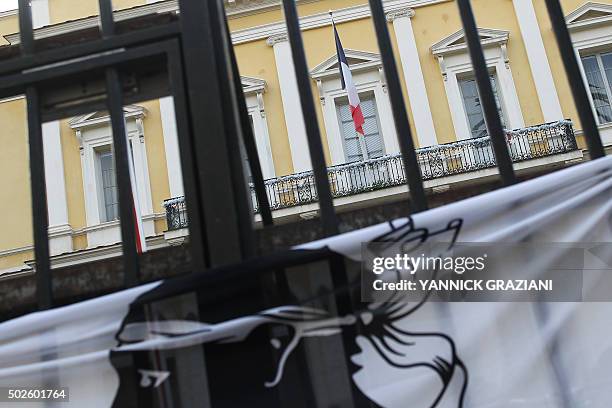 Picture taken on December 27, 2015 shows a Corsican flag on the gate of the prefecture in Ajaccio, after France banned demonstrations in part of the...