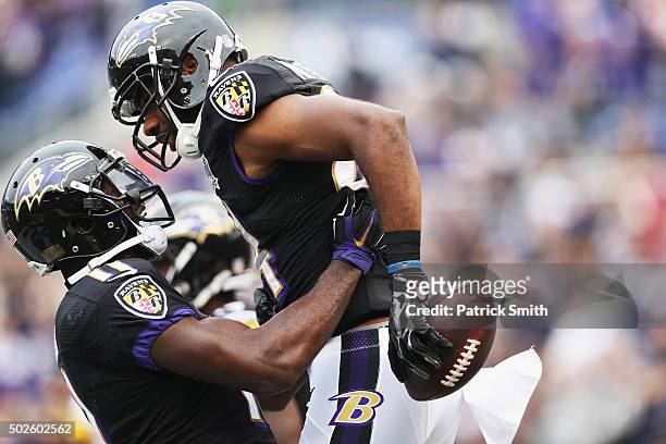 Chris Matthews of the Baltimore Ravens, right, celebrates with his teammate Kamar Aiken after scoring a touchdown against the Pittsburgh Steelers at...