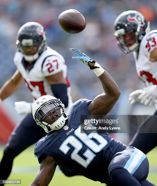 Antonio Andrews of the Tennessee Titans fumbles the ball during the first quarter against the Houston Texans at LP Field on December 27, 2015 in...