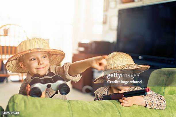 little boys explorers adeventuring in living room - pith stock pictures, royalty-free photos & images