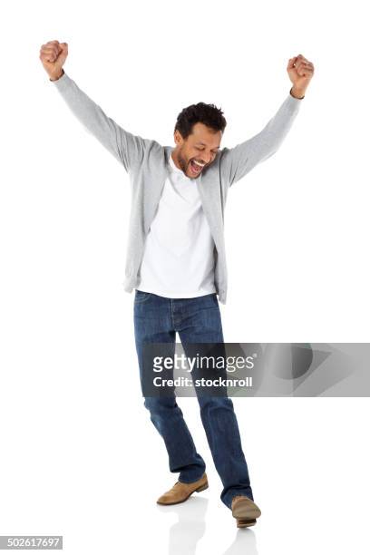 mature african man celebrating success - arms raised stock pictures, royalty-free photos & images