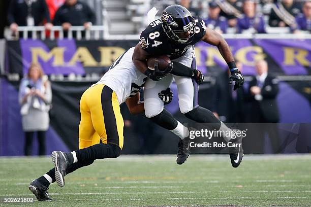 Chris Matthews of the Baltimore Ravens is tackled by Antwon Blake of the Pittsburgh Steelers during the first quarter at M&T Bank Stadium on December...