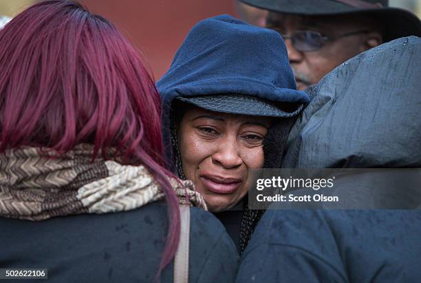 Janet Cooksey is comforted as she listens to speakers talk about the deaths of her son Quintonio LeGrier, and Bettie Jones before the start of a...