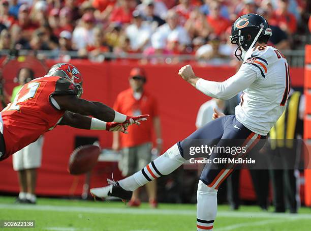 Linebacker Jeremiah George of the Tampa Bay Buccaneers blocks a punt by punter Pat O'Donnell of the Chicago Bears in the first quarter at Raymond...
