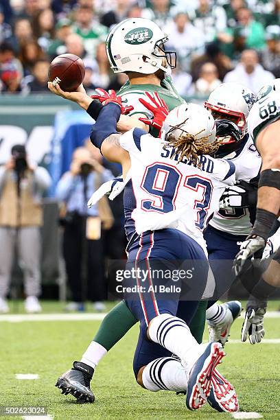 Jabaal Sheard of the New England Patriots sacks Ryan Fitzpatrick of the New York Jets to fumble the ball in the third quarter during their game at...