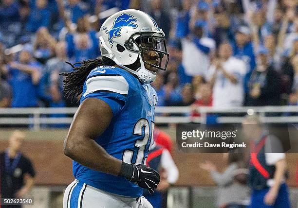 Joique Bell of the Detroit Lions celebrates a second quarter touchdown against the San Francisco 49ers during an NFL game at Ford Field on December...