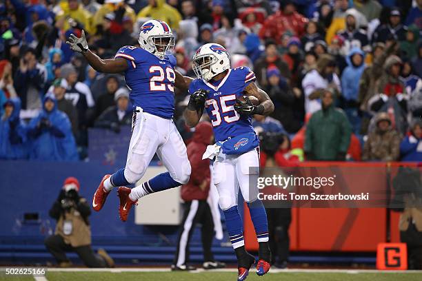 Mike Gillislee of the Buffalo Bills celebrates his touchdown with Karlos Williams of the Buffalo Bills during the second half against the Dallas...