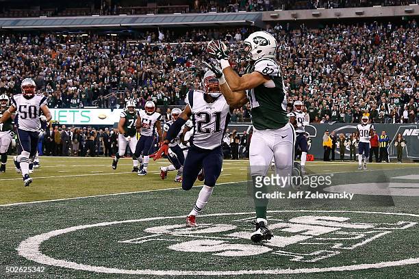 Eric Decker of the New York Jets scores the game winning touchdown in overtime against the New England Patriots in their game at MetLife Stadium on...