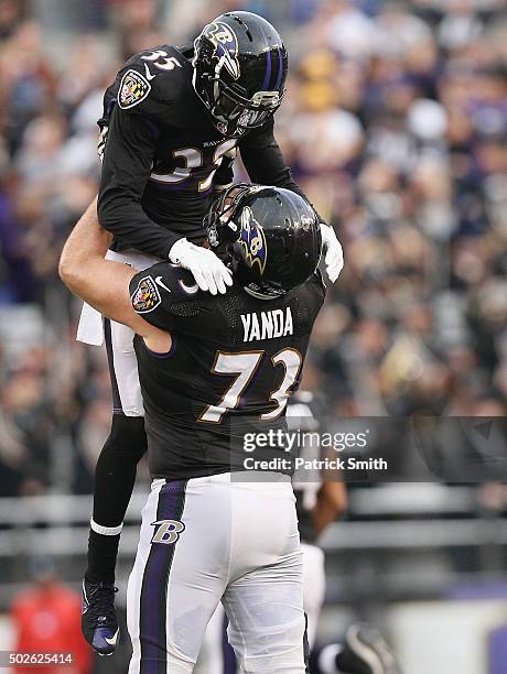 Marshal Yanda of the Baltimore Ravens and Shareece Wright celebrate during the fourth quarter against the Pittsburgh Steelers at M&T Bank Stadium on...