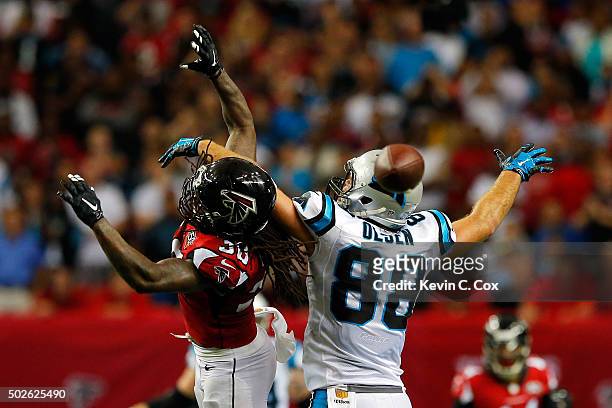 Charles Godfrey of the Atlanta Falcons breaks up a pass intended for Greg Olsen of the Carolina Panthers on fourth down during the second half at the...