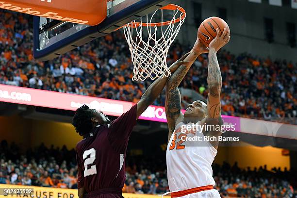 DaJuan Coleman of the Syracuse Orange is fouled by Chris Thomas of the Texas Southern Tigers while shooting the ball during the second half at the...