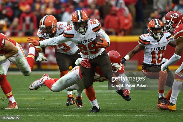 Duke Johnson of the Cleveland Browns is tackled by Josh Mauga of the Kansas City Chiefs at Arrowhead Stadium during the fourth quarter of the game on...