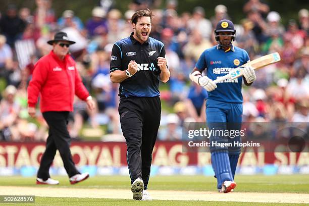 Mitchell McClenaghan of New Zealand celebrates after taking the wicket of Lahiru Thirimanne during the second One Day International game between New...