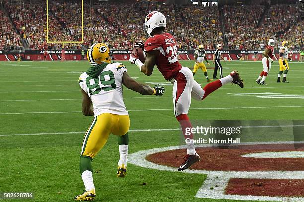 Cornerback Justin Bethel of the Arizona Cardinals intercepts the football intended for wide receiver James Jones of the Green Bay Packers during the...