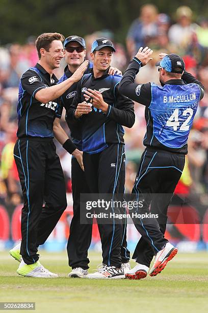 To R, Matt Henry, Martin Guptill, Mitchell Santner and Brendon McCullum of New Zealand celebrate the wicket of Danushka Gunathilaka of Sri Lanka...