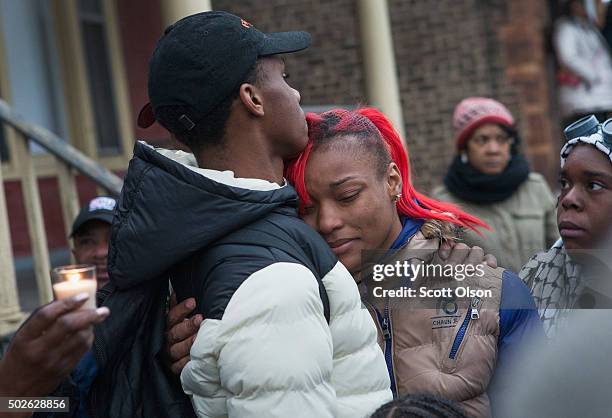LaTonya Jones, the daughter of Bettie Jones, is comforted during a vigil outside their home on December 27, 2015 in Chicago, Illinois. Bettie Jones...