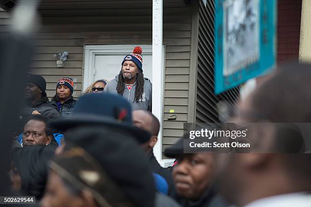 Family, friends and supporters gather outside the home of Bettie Jones and Quintonio LeGrier during a vigil on December 27, 2015 in Chicago,...