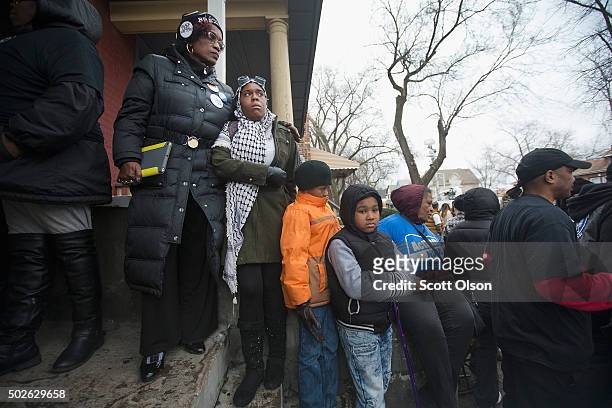 Family, friends and supporters gather outside the home of Bettie Jones and Quintonio LeGrier during a vigil on December 27, 2015 in Chicago,...