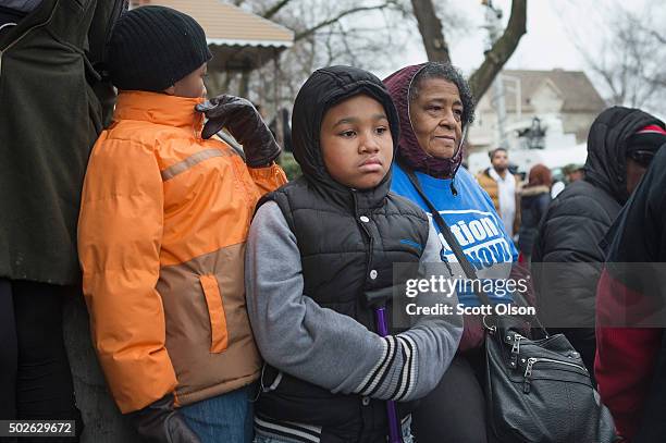 Family, friends and supporters gather outside the home of Bettie Jones and Quintonio LeGrier during a vigil on December 27, 2015 in Chicago,...