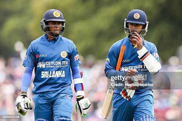 Jeffrey Vandersay and Nuwan Kulasekara of Sri Lanka leave the field at the end of the innings during the second One Day International game between...