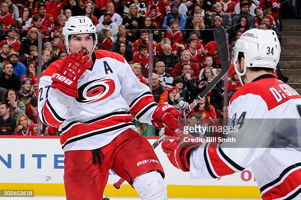 Justin Faulk of the Carolina Hurricanes reacts after scoring against the Chicago Blackhawks in the second period of the NHL game at the United Center...