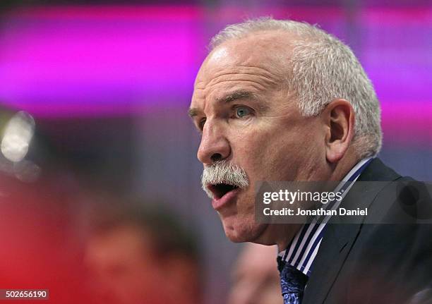 Head coach Joel Quenneville of the Chicago Blackhawks gives instructions to his team against the Carolina Hurricanes at the United Center on December...