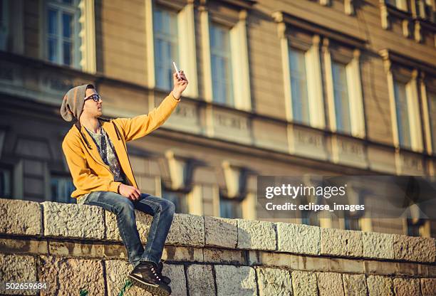 young man taking selfie - smirking stock pictures, royalty-free photos & images