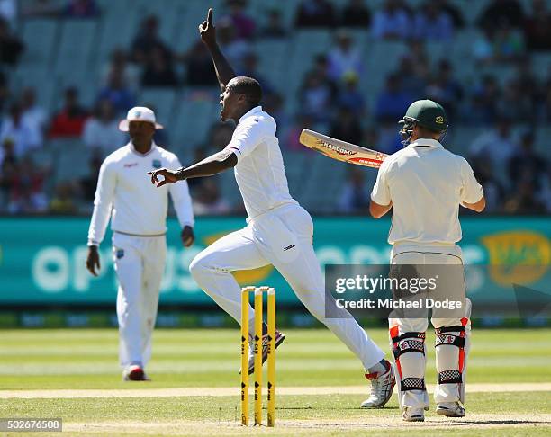 Carlos Brathwaite of the West Indies celebrates his wicket of David Warner of Australia during day three of the Second Test match between Australia...