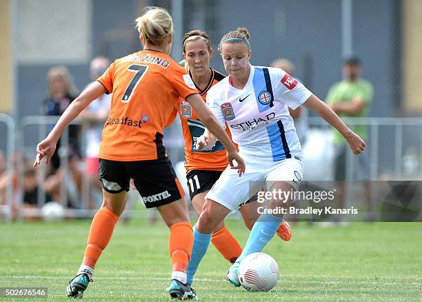 Amy Jackson of Melbourne City looks to take on the defence during the round 11 W-League match between Brisbane Roar and Melbourne City FC at Perry...