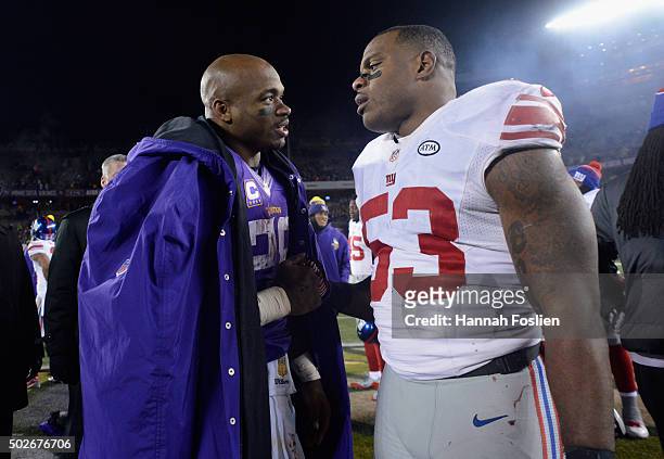 Adrian Peterson of the Minnesota Vikings and Jasper Brinkley of the New York Giants speak after the game on December 27, 2015 at TCF Bank Stadium in...