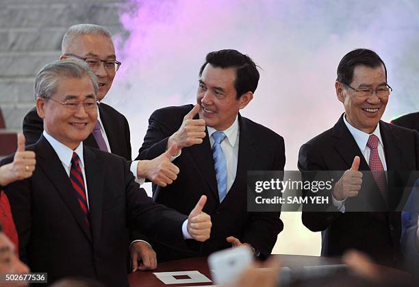 Taiwan President Ma Ying-jeou gestures with other officials as they attend the opening ceremony for the new National Palace Museum branch in the...