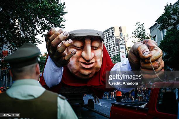 Giant effigy of Chilean poet Pablo Neruda is seen during the street carnival 'Neruda coming flying' in honor to Pablo Neruda, Nobel literature Prize...