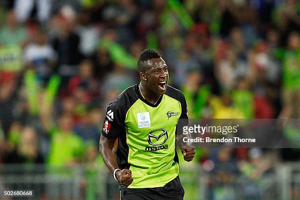 Andre Russell of the Thunder celebrates after claiming the wicket of Brad Hodge of the Strikers during the Big Bash League match between the Sydney...