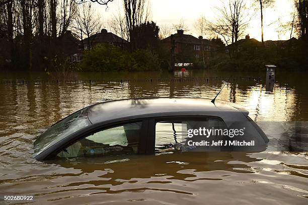 Vehicles are inundated as flood waters begin to recede in the Huntington Road area of York after the River Foss burst its banks, on December 28, 2015...