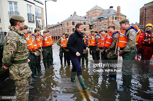 Prime Minister David Cameron meets soldiers working on flood relief in York city centre after the river Ouse burst its banks, on December 28, 2015 in...