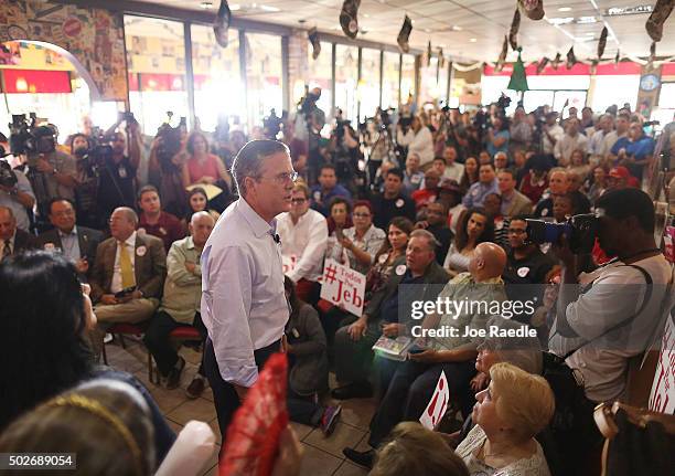 Republican presidential candidate and former Florida Governor Jeb Bush attends a meet and greet event at Chico's Restaurant on December 28, 2015 in...