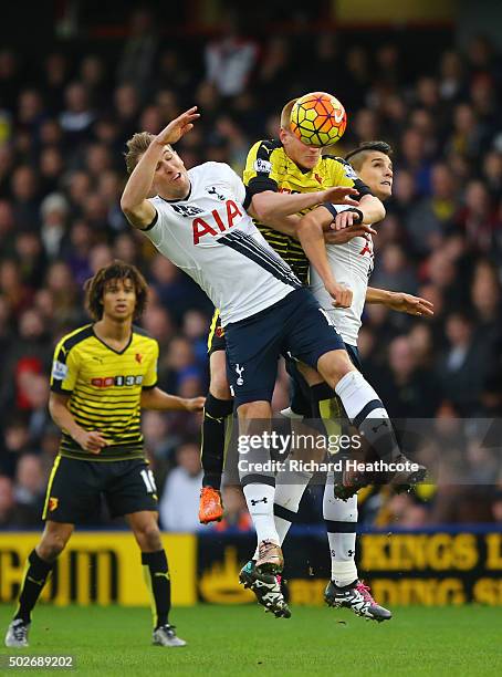 Ben Watson of Watford competes for the ball against Harry Kane and Erik Lamela of Tottenham Hotspur during the Barclays Premier League match between...