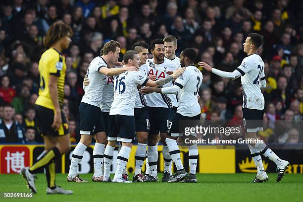 Erik Lamela of Tottenham Hotspur celebrates scoring his team's first goal with his team mates during the Barclays Premier League match between...