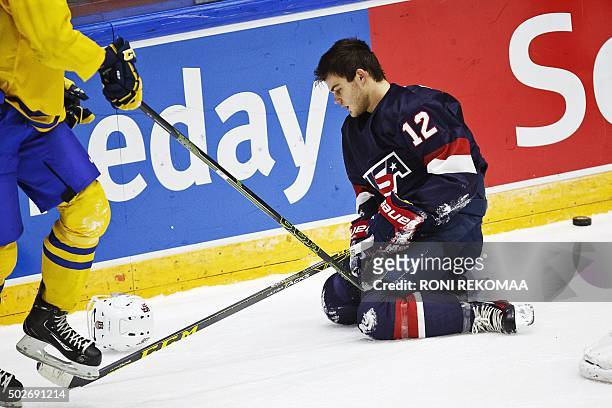 Alex Debricant of USA was injured during the first period of the 2016 IIHF World Junior Ice Hockey Championship match between Sweden and USA in...