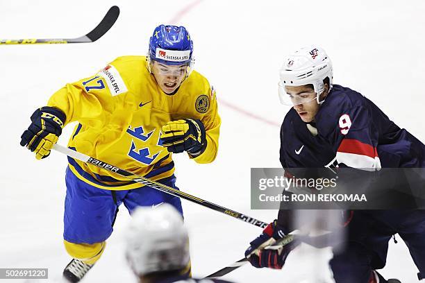 Dmytro Timashov of Sweden and Nick Schmaltz of USA in action during the 2016 IIHF World Junior Ice Hockey Championship match between Sweden and USA...