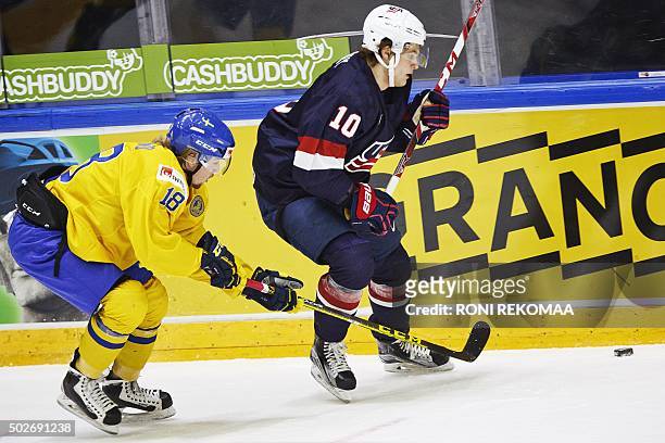 Alexander Nylander of Sweden and Anders Bjork of USA in action during the 2016 IIHF World Junior Ice Hockey Championship match between Sweden and USA...