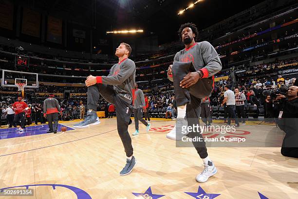 Blake Griffin and DeAndre Jordan of the Los Angeles Clippers warm up before the game against the Los Angeles Lakers at Staples Center on December 25,...