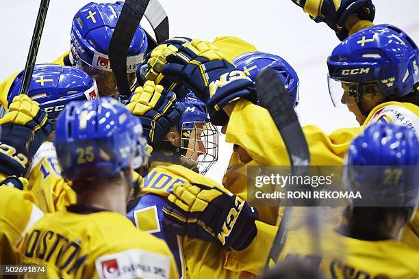 Alexander Nylander of Sweden and teammates celebrate after Nylander scored 1-0 during the 2016 IIHF World Junior Ice Hockey Championship match...