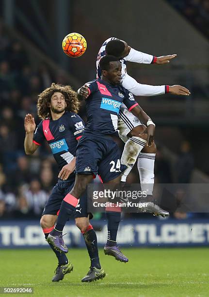 Victor Anichebe of West Bromwich Albion and Cheik Ismael Tiote of Newcastle United compete for the ball during the Barclays Premier League match...