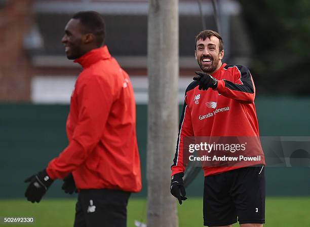 Jose Enrique and Christian Benteke of Liverpool in action during a training session at Melwood Training Ground on December 28, 2015 in Liverpool,...