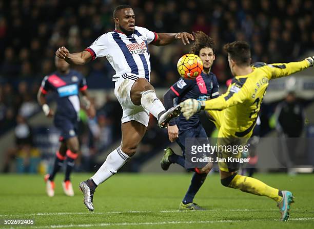 Victor Anichebe of West Bromwich Albion and Karl Darlow of Newcastle United compete for the ball during the Barclays Premier League match between...