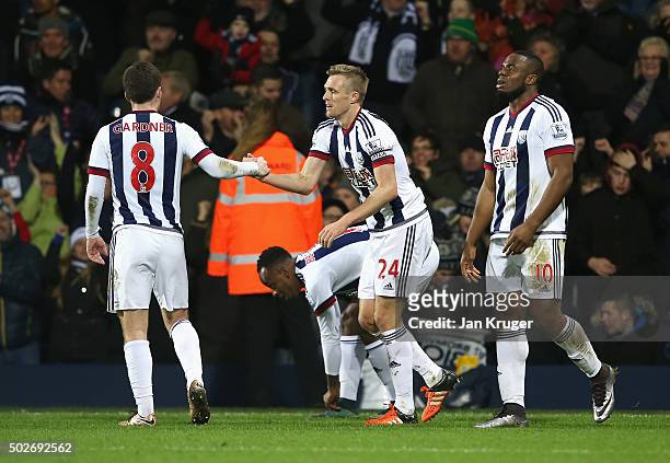 Darren Fletcher of West Bromwich Albion celebrates scoring his team's first goal with his team mates during the Barclays Premier League match between...